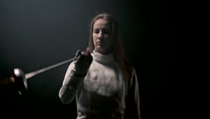 Stock Video A Young Woman Fencer Playing With Her Sword Live Wallpaper For PC