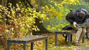 Stock Video A Young Man With A Laptop On A Park Bench Live Wallpaper For PC