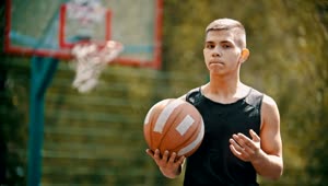 Stock Video A Young Man Holding A Basketball Ball Live Wallpaper For PC
