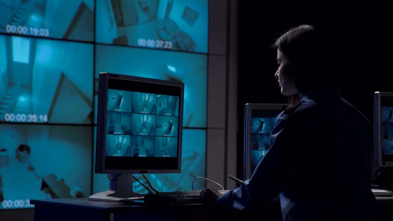 Download Stock Video A Woman Working On The Security Camera Room Live Wallpaper For PC
