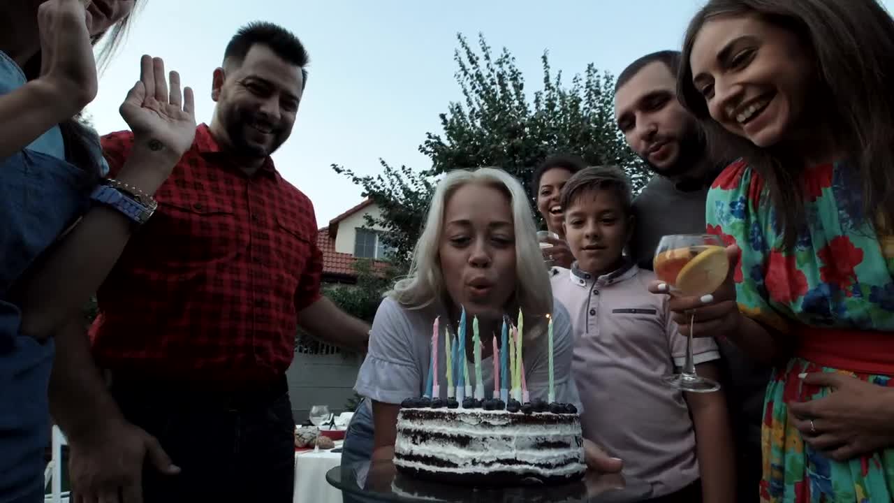 Download Stock Video A Woman Blows The Candles In A Birthday Party Live Wallpaper For PC