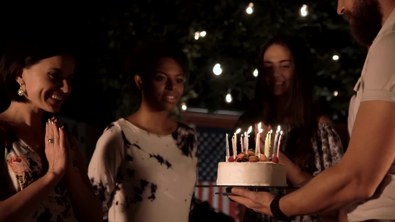 Download Stock Video A Woman Blows The Candles Of The Birthday Cake Live Wallpaper For PC