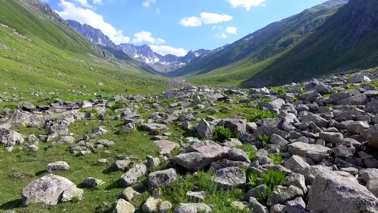 Download Stock Video A Valley Filled With Rocks And A Stream Live Wallpaper For PC
