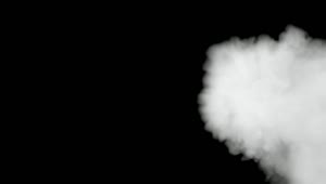 Stock Video A Thick Blow Of Smoke On A Black Background Live Wallpaper For PC