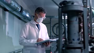 Stock Video A Scientist With A Face Mask On The Laboratory Live Wallpaper For PC