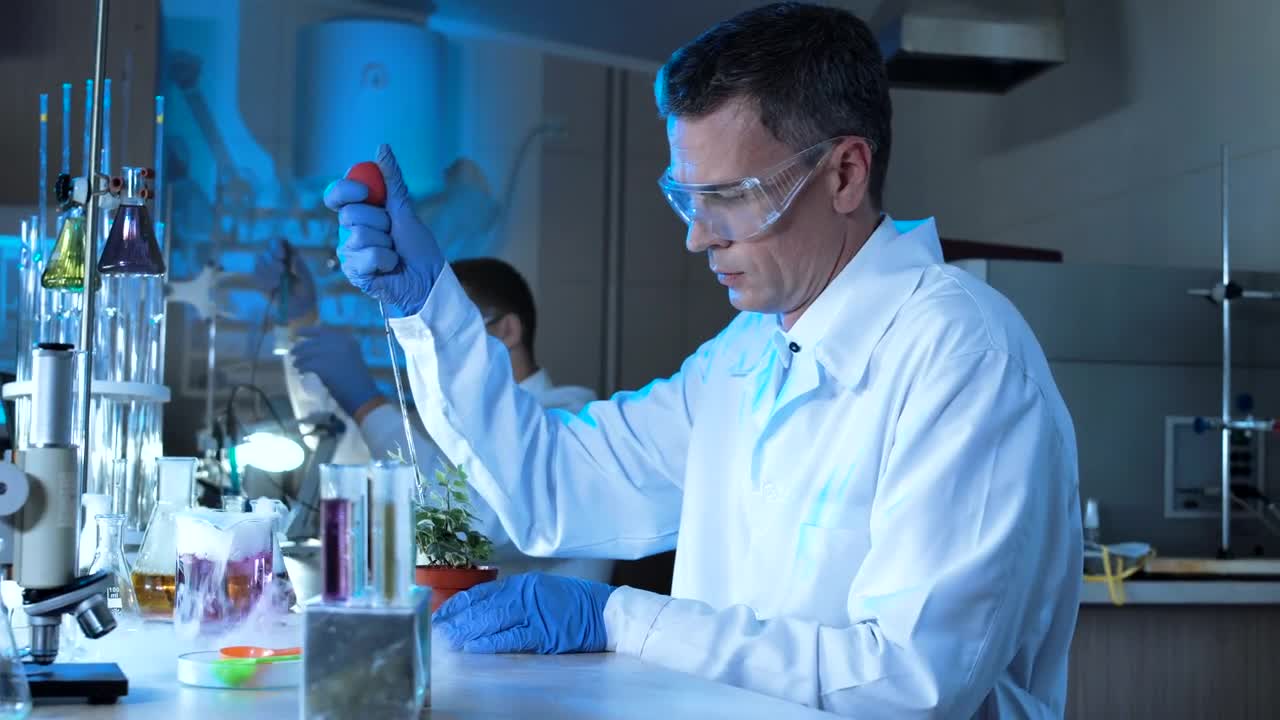 Download Stock Video A Scientist Experimenting With A Plant In The Lab Live Wallpaper For PC