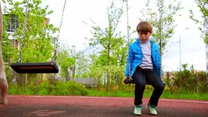 Stock Video A Sad Boy Sitting On The Swings Live Wallpaper For PC