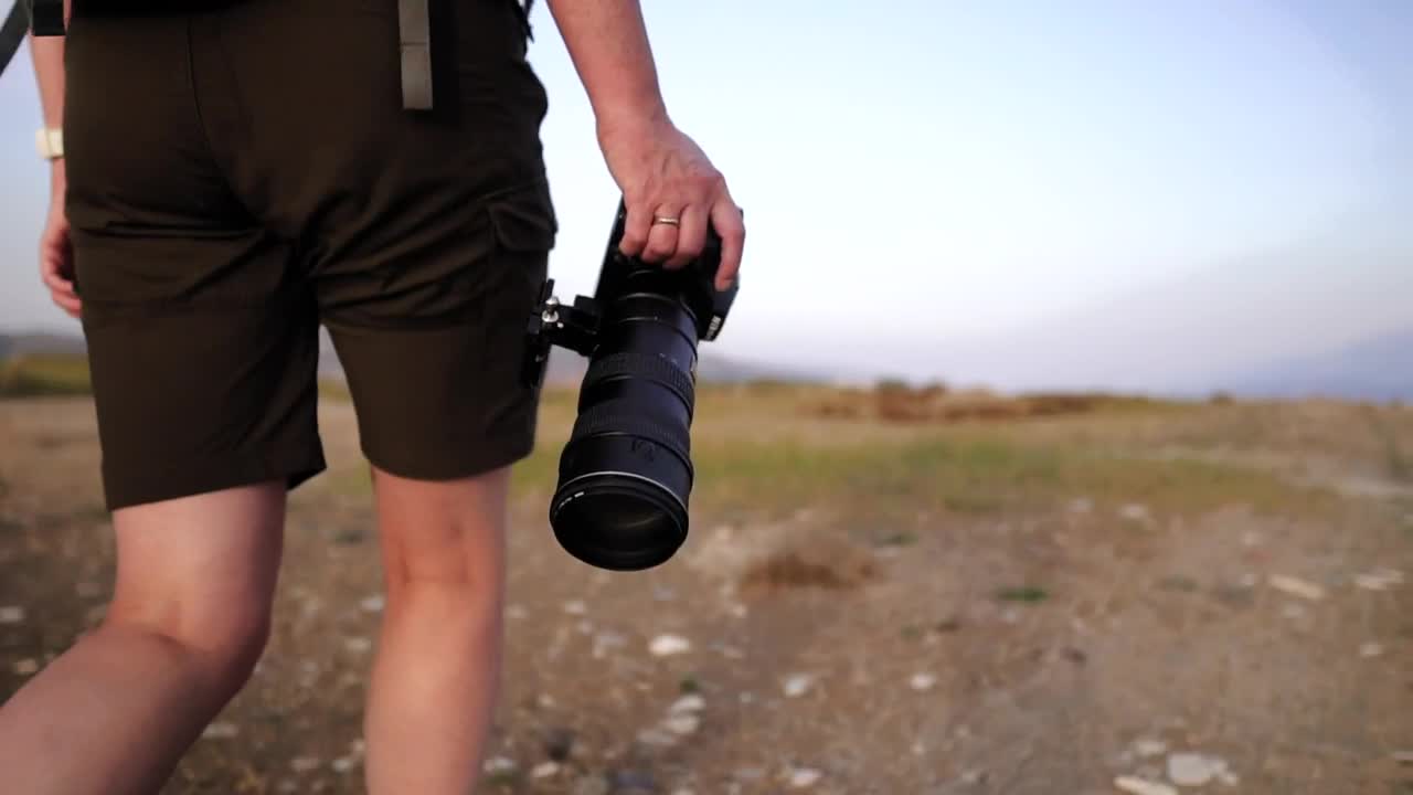 Download Stock Video A Photographer Walking In Nature Live Wallpaper For PC