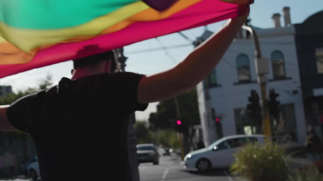 Download Stock Video A Man Waving A Rainbow Flag Live Wallpaper For PC