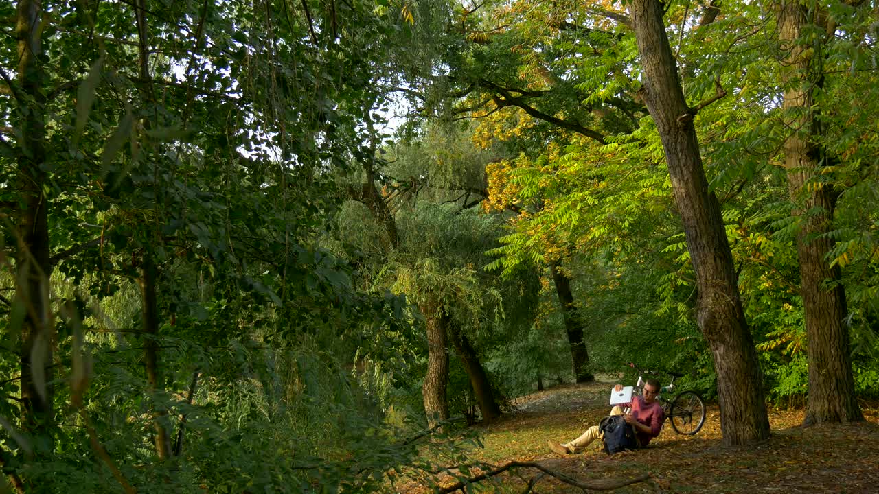 Download Stock Video A Man Takes Out A Laptop From The Backpack In Live Wallpaper For PC