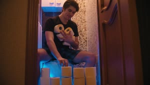 Stock Video A Man Sitting On The Toilet Making A Toilet Paper Live Wallpaper For PC