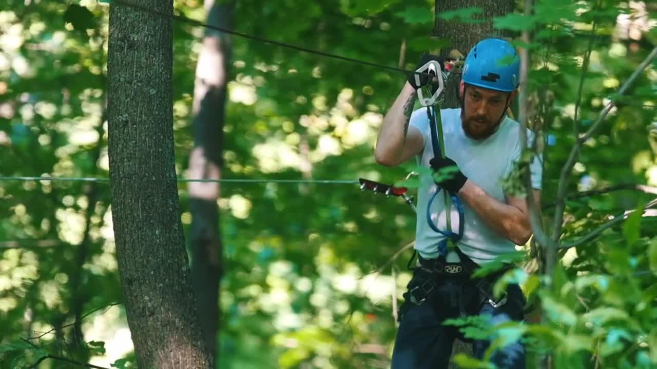 Download Stock Video A Man In A Security Helmet On A Rope Adventure Live Wallpaper For PC
