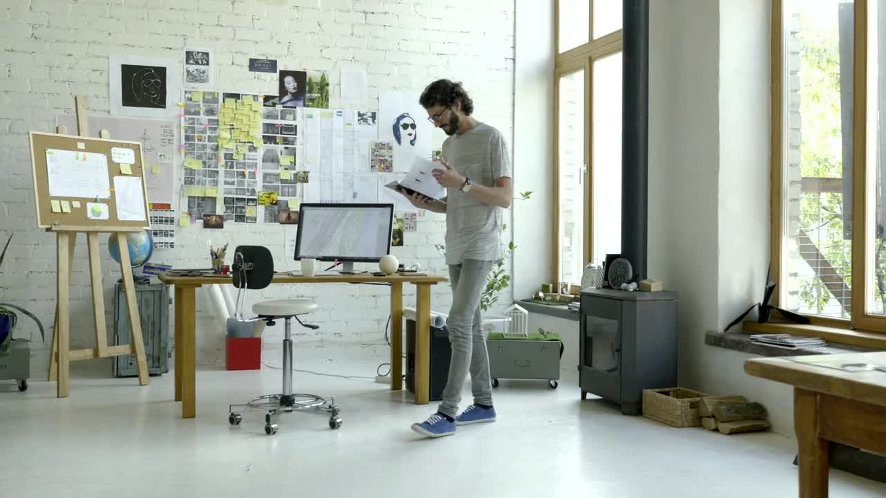 Download Stock Video A Man Checking His Notes In The Studio Live Wallpaper For PC