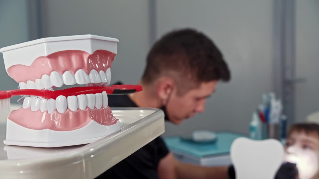 Download Stock Video A Little Boy Having Treatment With The Dentist Live Wallpaper For PC