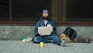 Stock Video A Homeless Man Begging Sitting On The Street Live Wallpaper For PC
