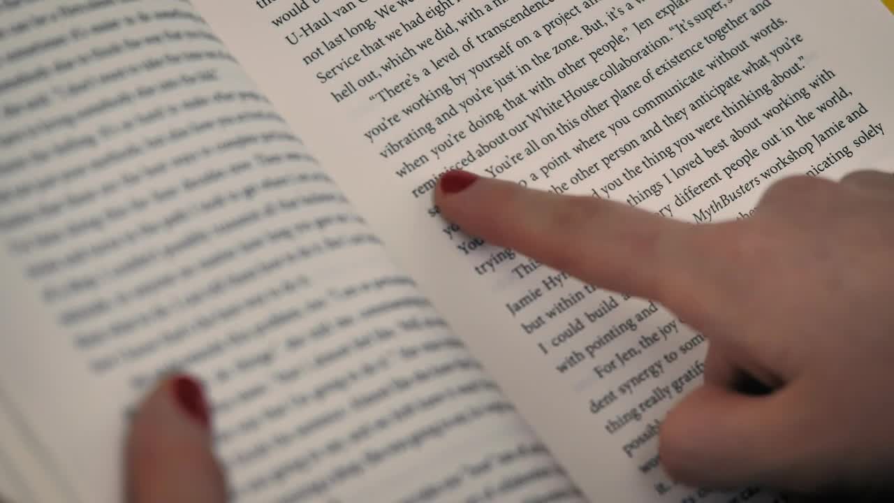 Download Stock Video A Girls Hand With A Book Following The Reading With Live Wallpaper For PC