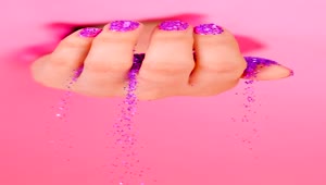 Stock Video A Girls Hand Spilling Glitter On A Pink Background Live Wallpaper For PC