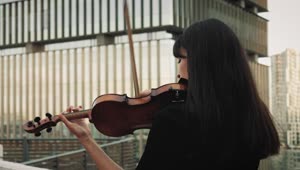 Stock Video A Female Violinist Playing Music On A Rooftop Live Wallpaper For PC