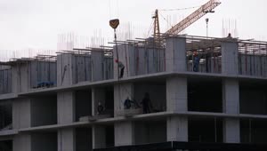 Stock Video Builders Lifting A Load In The Construction Site Live Wallpaper For PC