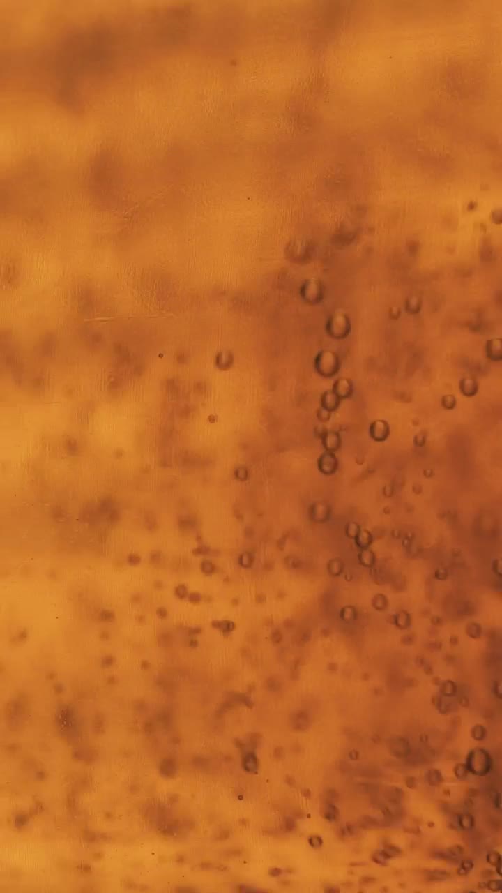 Download Stock Video Bubbles Moving Slowly In A Yellow Liquid Live Wallpaper For PC