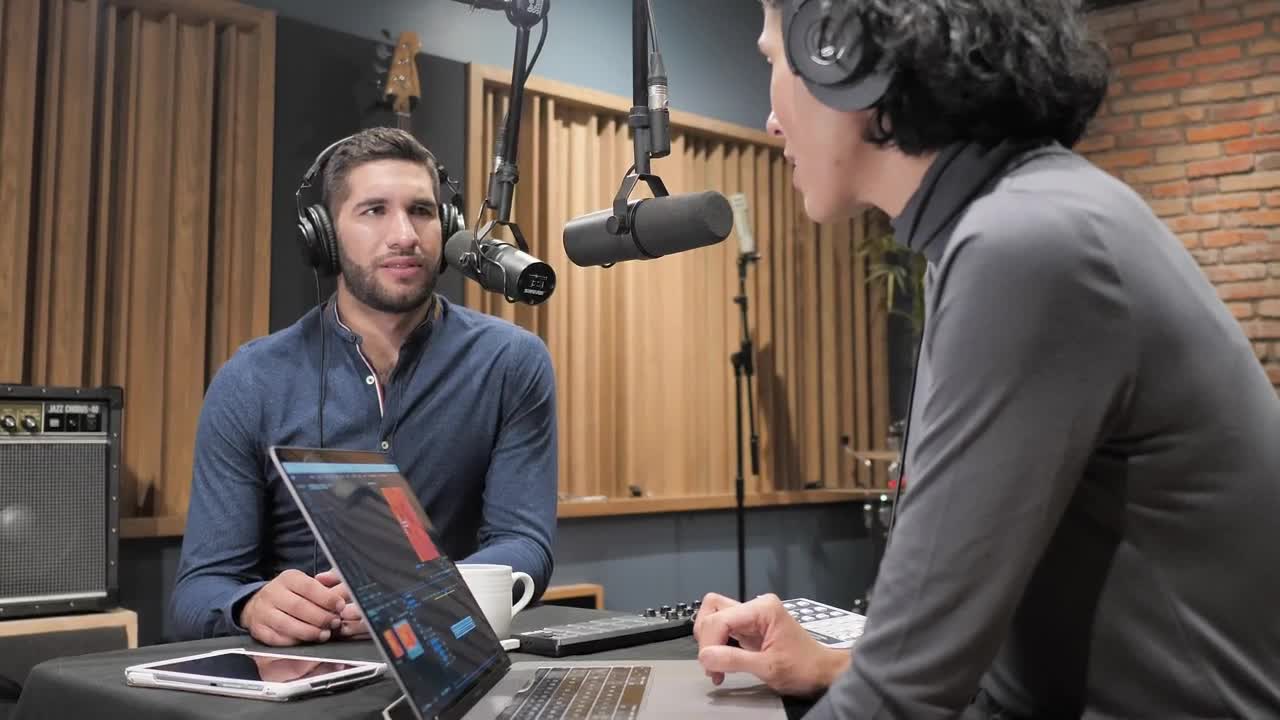 Download Stock Video Broadcasters Talking At Record Studio Live Wallpaper For PC