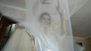 Stock Video Bride Tosses Veil While Dressing For Wedding Live Wallpaper For PC
