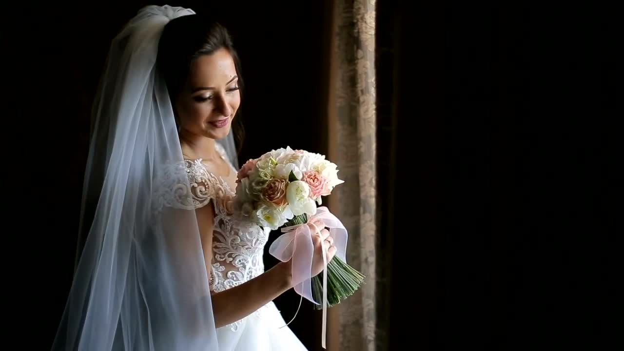 Download Stock Video Bride In Wedding Dress Holding Flower Bouquet On Black Background Live Wallpaper For PC