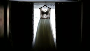 Stock Video Bride Admires Wedding Dress Hanging In Window Live Wallpaper For PC