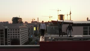 Stock Video Boys Enjoying The View Of The City On The Rooftop Live Wallpaper For PC