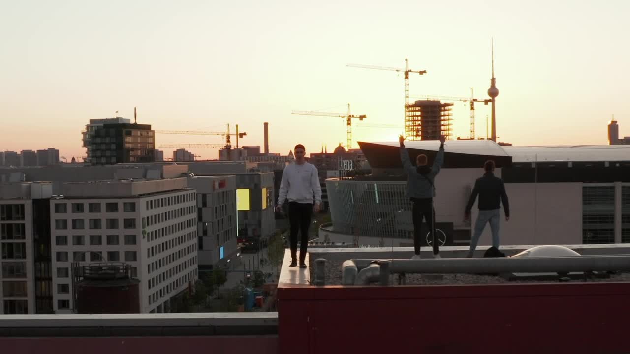Download Stock Video Boys Enjoying The View Of The City On The Rooftop Live Wallpaper For PC