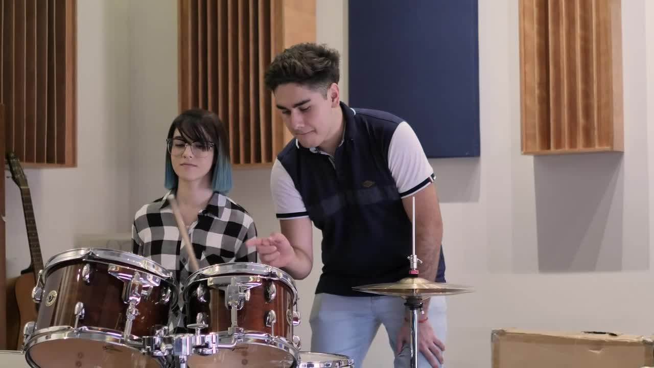 Download Stock Video Boy Teaching A Girl To Play Drums Live Wallpaper For PC