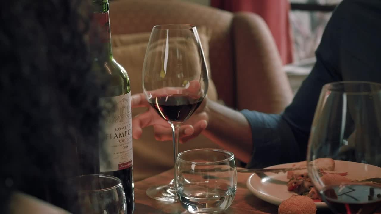 Download Stock Video Boy Takes His Glass Of Wine During A Dinner With Live Wallpaper For PC