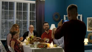 Stock Video Boy Takes A Photo Of Family In Thanksgiving Dinner Live Wallpaper For PC