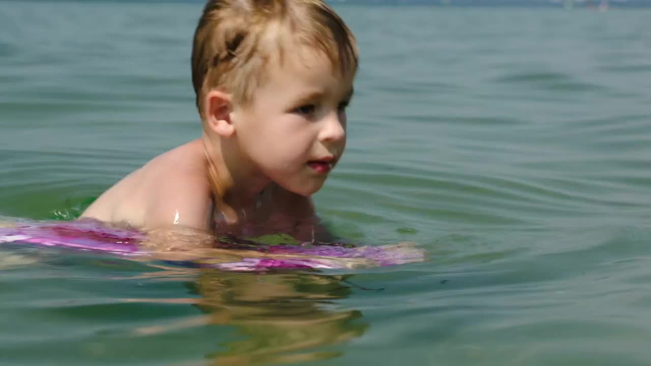 Download Stock Video Boy Swimming With A Board Live Wallpaper For PC
