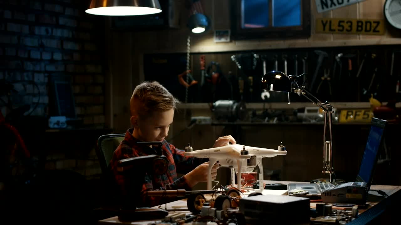 Download Stock Video Boy Repairing A Drone In The Garage Live Wallpaper For PC