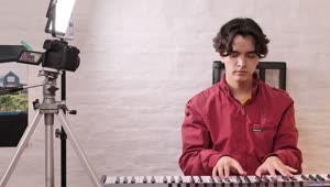 Stock Video Boy Playing Piano Being Recorded Live Wallpaper For PC