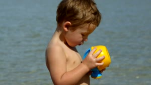 Stock Video Boy Looking At A Beach Toy Live Wallpaper For PC
