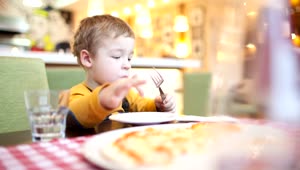 Stock Video Boy Eating Breakfast In A Cafe Live Wallpaper For PC