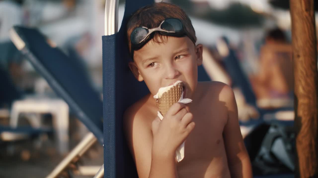 Download Stock Video Boy Eating An Ice Cream While On Holiday Live Wallpaper For PC