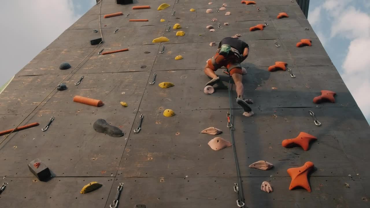 Download Stock Video Boy Climbing To The Top Of A Mountaineering Wall Live Wallpaper For PC