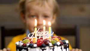 Stock Video Boy Blowing Out Candles On A Cake Live Wallpaper For PC