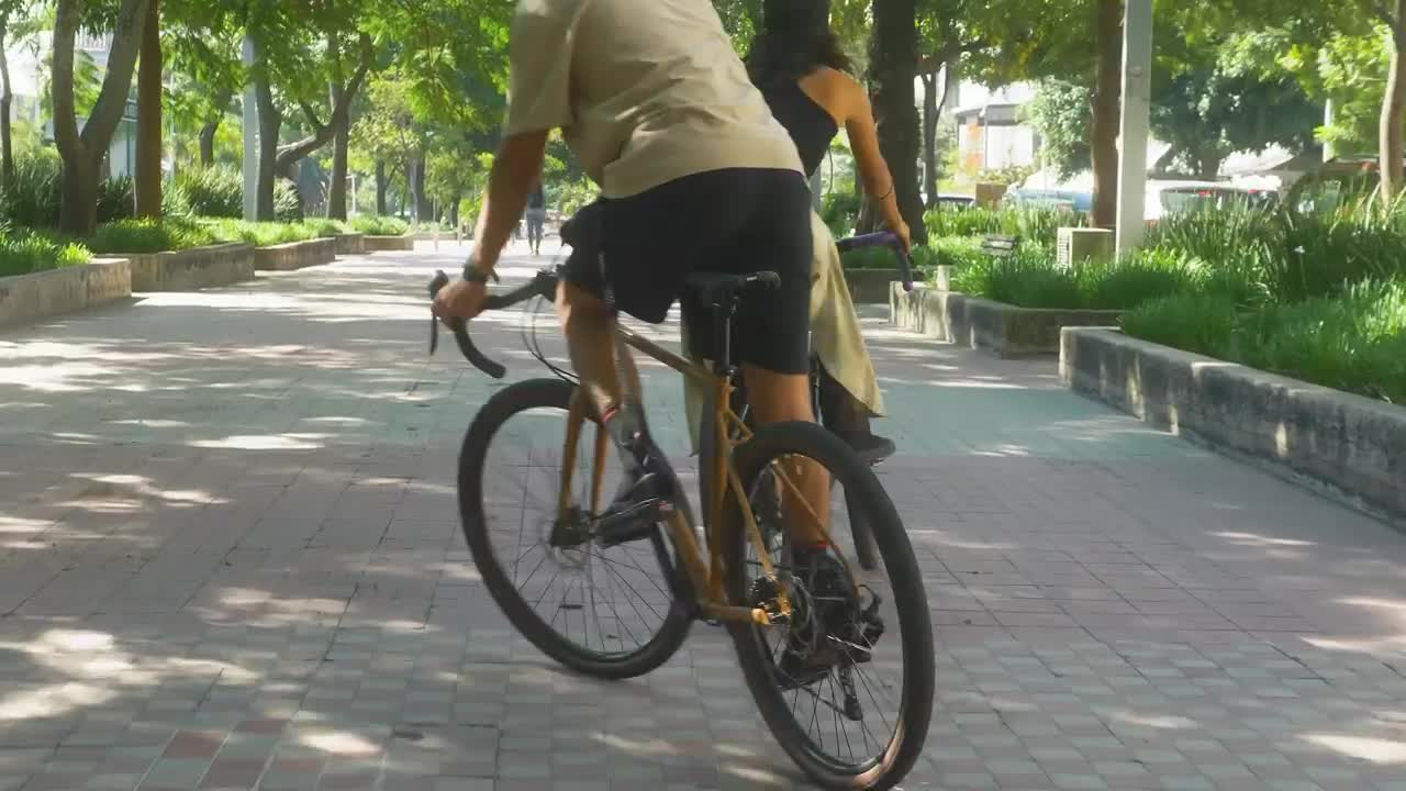 Download Stock Video Boy And Girl Zigzagging During A Bike Ride Live Wallpaper For PC