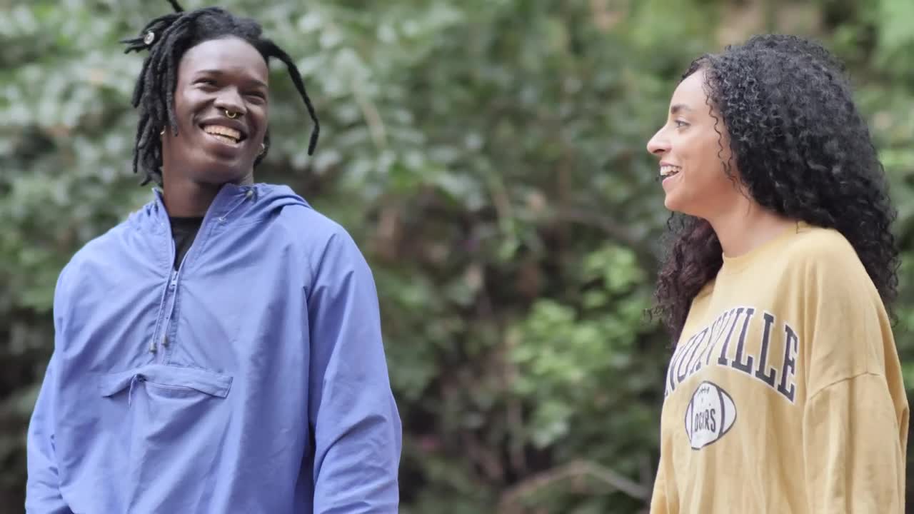 Download Stock Video Boy And Girl Walking Talking And Laughing In A Park Live Wallpaper For PC