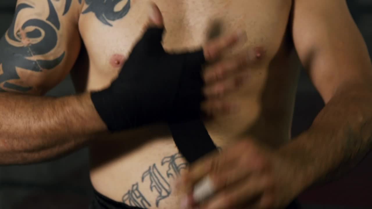 Download Stock Video Boxer Wrapping Their Hands In Black Fabric Live Wallpaper For PC