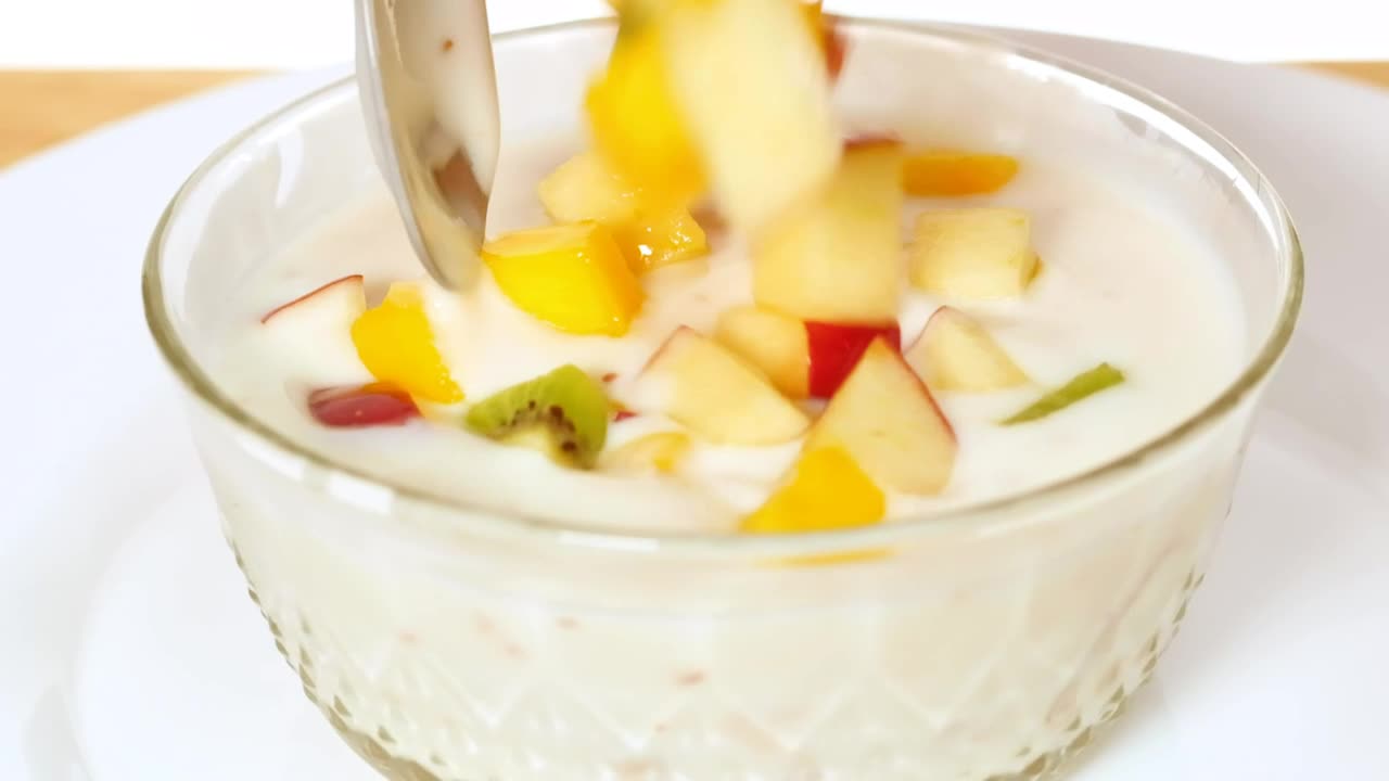 Download Stock Video Bowl With Yogurt Served With Chopped Fruit Live Wallpaper For PC