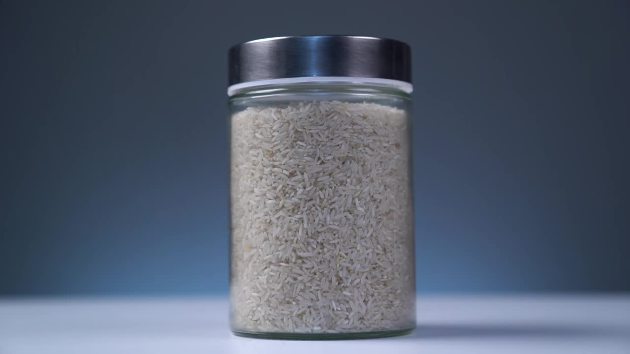 Download Stock Video Bowl Full Of Rice On A Table With Blue Background Live Wallpaper For PC