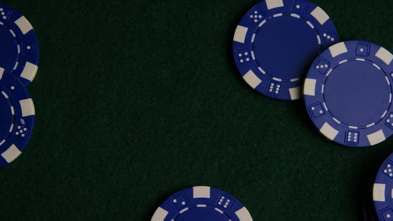 Download Stock Video Blue Casino Chips On A Green Surface Live Wallpaper For PC