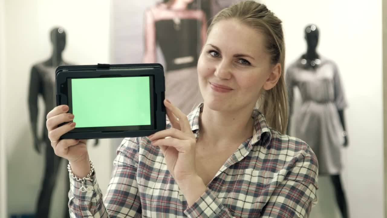 Download Stock Video Blonde Woman Showing A Tablet With A Green Screen Live Wallpaper For PC
