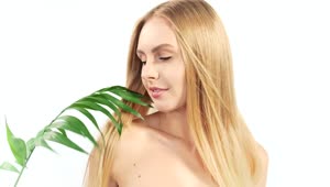 Stock Video Blonde Woman And A Green Fern On A White Background Live Wallpaper For PC