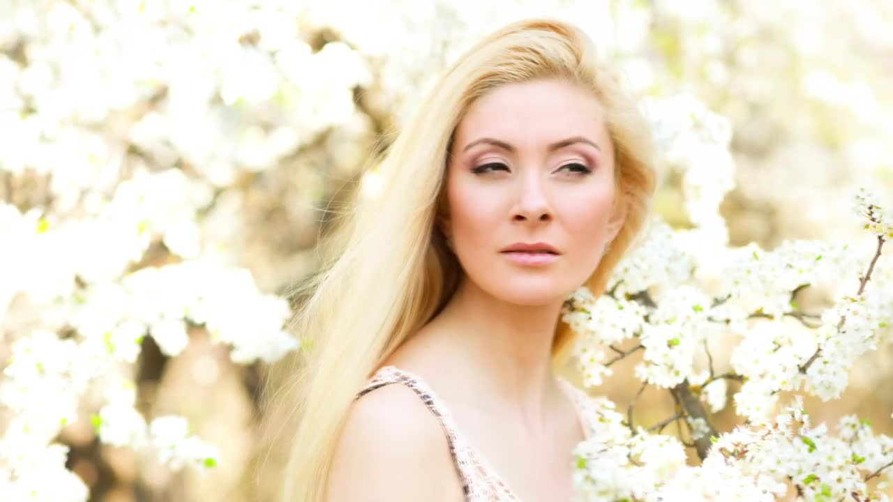 Download Stock Video Blonde Woman Among White Flowers Portrait Live Wallpaper For PC